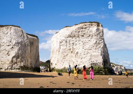 Kent UK. 06th August 2023. UK Weather. Strong  winds can be felt and choppy sea water seen at Kent south coast while Storm Antoni hits England' south west coast with near-80mph gusts. People still enjoying sunny day on beach swimming in incoming waves. Credit: xiu bao/Alamy Live News Stock Photo