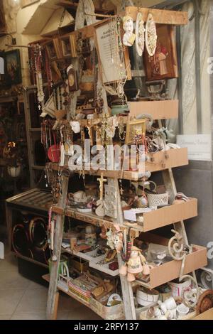 Small items for sale at an antique shop in Lecce, Italy Stock Photo