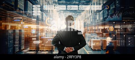 Smart warehouse, inventory management system concept, a manager using Ai showing warehouse software management dashboard on the blurred warehouse as b Stock Photo