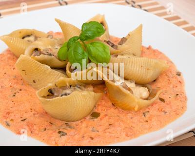 Conchiglie pasta with mushrooms Stock Photo