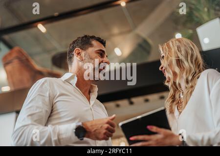 Business people working, having fun and chatting at workplace office Stock Photo