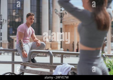 Good looking male started falling in love with his female friend. He is staring at her Stock Photo