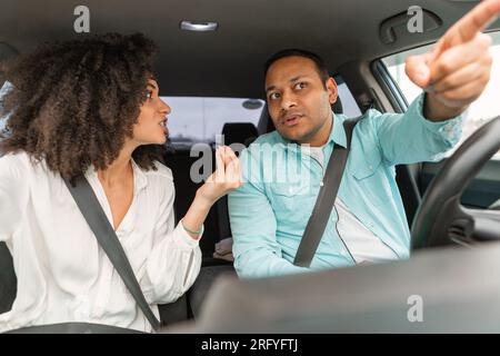 Displeased Middle Eastern Couple Engaging in Quarrel During Auto Trip Stock Photo
