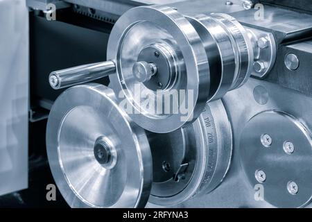 Lathe control knobs close up blue tone. Metal machine tools industry. The metalworking process by turning machine. machinery industry metal processing Stock Photo