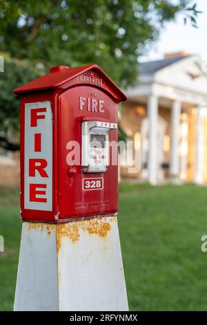 Ridgewood, NJ - USA – Aug 2, 2023 Horitzontal view of a red and white callbox,  also know as a fire alarm box or fire alarm pull box. The device is us Stock Photo