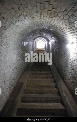 Stone stairs inside a tunnel at Drop Redoubt fort, Dover, England. Stock Photo