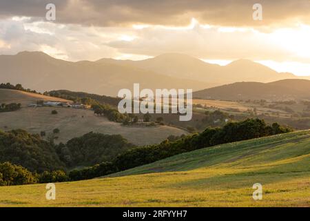 Sunset in the hills of the village of Arcevia in the province of Ancona in the Marche region of Italy. Stock Photo