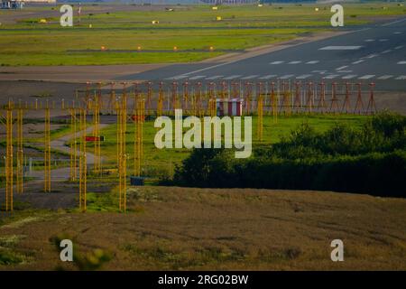 Helsinki / Finland - AUGUST 5, 2023: An Airport tarmac with taxiways. Runway signs and markings. Approach lights. Stock Photo
