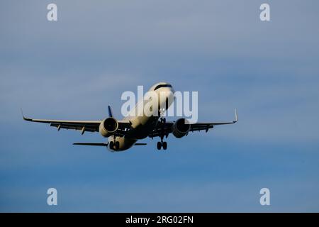Helsinki / Finland - AUGUST 5, 2023:A commercial airplane approaching the airport during sunset. Stock Photo