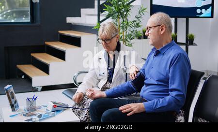 Traumatologist using tonometer instrument to measure patient pulse ...