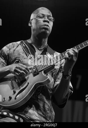 LIONEL LOUEKE plays guitar for Herbie Hancock on the main stage of the MONTEREY JAZZ FESTIVAL Stock Photo