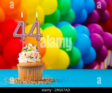 Burning birthday candles number 44 Stock Photo - Alamy