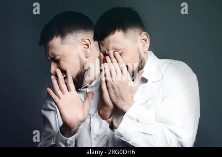 Suffering from hallucinations. Double exposure with photos of man on dark background Stock Photo