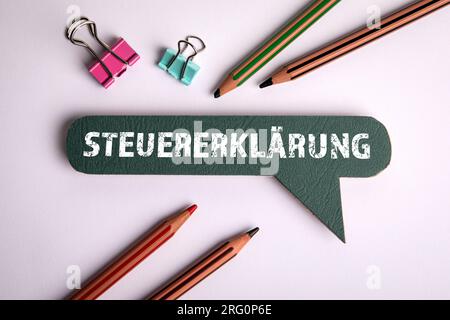 Tax Return. Text in German on a green speech bubble. Stock Photo