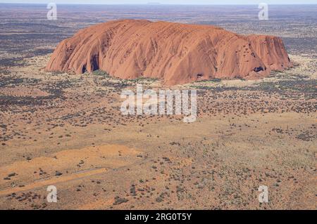 Uluu, northwest and southwest aspects, aerial view, with Mount Connor in the distance, 100 km away. Uluru-Kata Tjuta National Park, Northern Territory Stock Photo