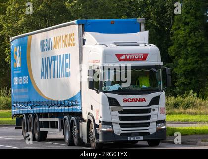 Milton Keynes,UK - July 28th 2023:  2018 Scania 3 axle + 3 axle artic lorry travelling on an English road Stock Photo