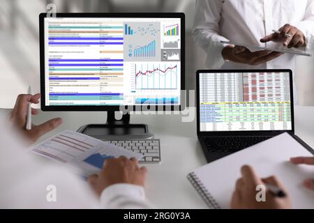 Businessmen work hard. Using analytics, Data analytics, statistics, information, Business Technology Intelligence (BI), and business strategy for fina Stock Photo
