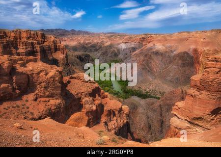Beautiful Clay castles in Canyon of Charyn River in Kazakhstan, a beautiful view of the clay rocks and the road to the gorge on a sunny day Stock Photo