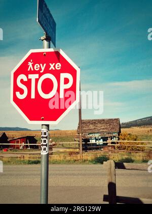 British Columbia, Canada - October 01, 2021: Bilingual stop sign in English and First Nations language near Merritt a city in the Nicola Valley of the Stock Photo
