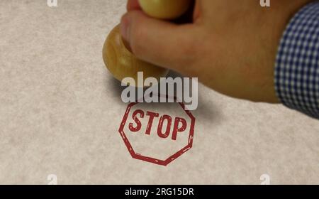 Stop stamp and stamping hand. Blocked and ban concept. Stock Photo