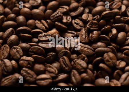 Textured background of freshly roasted coffee beans Stock Photo