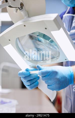 A laboratory assistant conducts research with biomaterial in the laboratory. Stock Photo