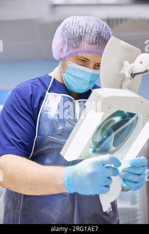 A laboratory assistant conducts research with biomaterial in the laboratory. Stock Photo