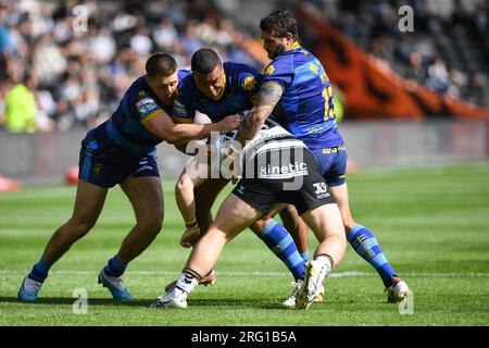Kingston upon Hull, England - 6th August 2023 Jack Brown of Hull FC tackled by Wakefield Trinity's Tom Lineham, Reece Lyne and Jay Pitts. Rugby League  Betfred Super League , Hull FC vs Wakefield Trinity at MKM Stadium, Kingston upon Hull, UK Stock Photo