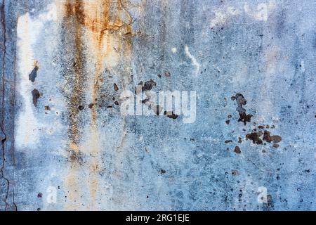 Texture of an old damaged concrete wall with cracks and stains as grunge background Stock Photo