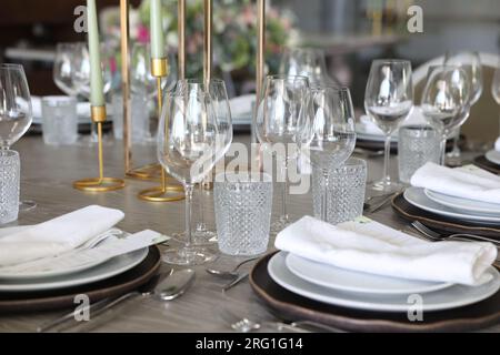Elegant Party table set for events and weddings. Luxury cutlery and fancy reception. Stock Photo