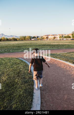 Small child walking on path Stock Photo