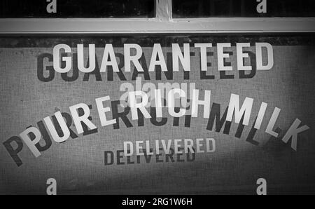 Guaranteed ,Pure Rich milk, delivered from the dairy / bakery, 34 Town Gate, Heptonstall, Hebden Bridge, West Yorkshire, England, UK, HX7 7LW Stock Photo