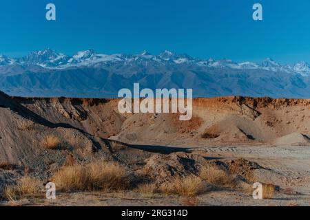 Sand and gravel quarry on mountains background, Kyrgyzstan Stock Photo