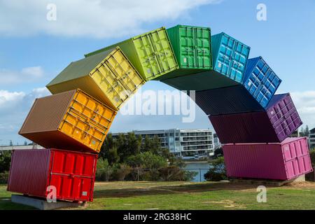 Containbow - a rainbow arch shipping container sculpture installation by Marcus Canning. Stock Photo