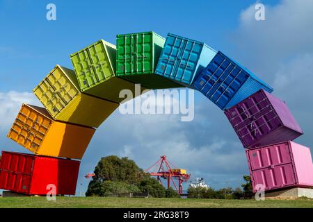 Containbow - a rainbow arch shipping container sculpture installation by Marcus Canning. Stock Photo