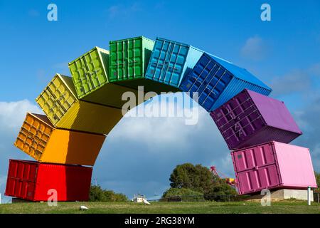 Containbow - a rainbow arch shipping container sculpture installation by Marcus Canning. Stock Photo