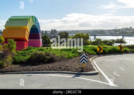 Containbow - a rainbow arch shipping container sculpture installation by Marcus Canning. Stock Photo