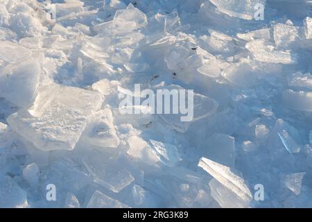 Big frozen ice cubes on an iced lake with snow and sunshine around Stock  Photo - Alamy