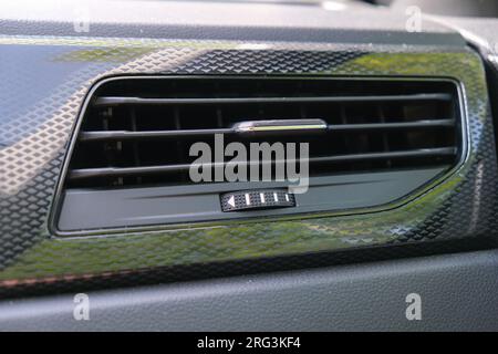 Close up modern heat vent air cooling ventilation hot cold flow inside car. Stock Photo