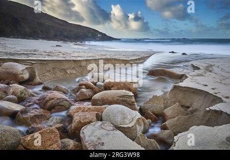 Sand, rock, cliff and Atlantic surf; Portheras Cove, Pendeen, on the Atlantic coast, in the far west of Cornwall, Great Britain. Stock Photo