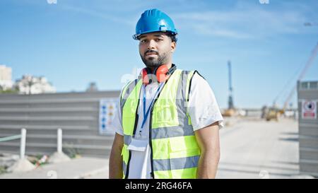 African american man builder standing with relaxed expression at street Stock Photo