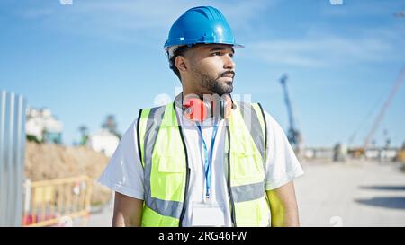 African american man builder standing with relaxed expression at street Stock Photo