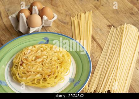 pasta omelette with together some of the ingredients to prepare it Stock Photo