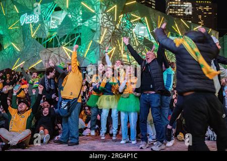 Melbourne, Australia, 7th August 2023. Fans watching the match between the Matildas and Denmark at Federation Square celebrate Australia's first goal of the game. Credit: Jay Kogler/Alamy Live News Stock Photo