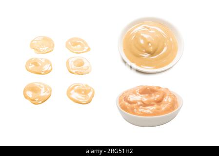 Mushroom sauce splashes isolated on white background. Top view. Stock Photo