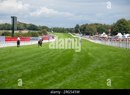 Jockeys ride up the Goodwood Racecourse during the Qatar Goodwood Festival Meeting 2023 at Goodwood Racecourse, Chichester Stock Photo