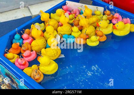 Yellow Rubber Ducks in Pool Amusement Park Fishing Game Stock