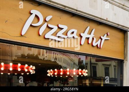 London, UK - July 31, 2023; Pizza Hut sign on store front location in Central London Stock Photo