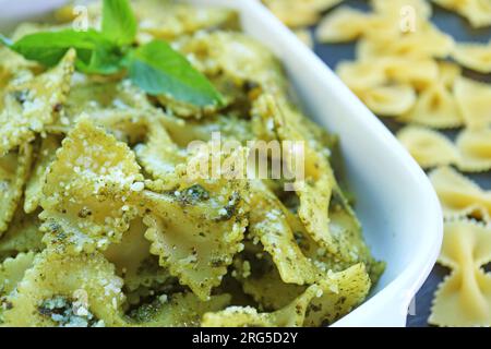 Closeup of Freshly Made Flavorful Pesto Farfalle Pasta Stock Photo