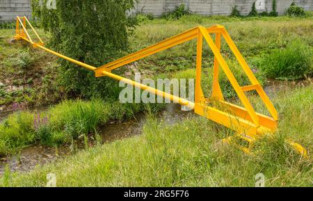 Natural Gas Pipeline Across the creek Stock Photo